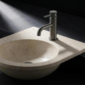 Fonte Basin Mixer Short in Cast Gunmetal mounted on a carved travertine basin
