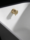 Fonte Overflow Filler in Cast Brass, installed in a bath