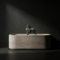 Fonte Wall-Mounted Bath Shower Mixer in Cast Nickel above a 1700 mm carved travertine bath
