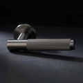 Asta Lever in Cast Gunmetal, knurled bar lever on a round rose